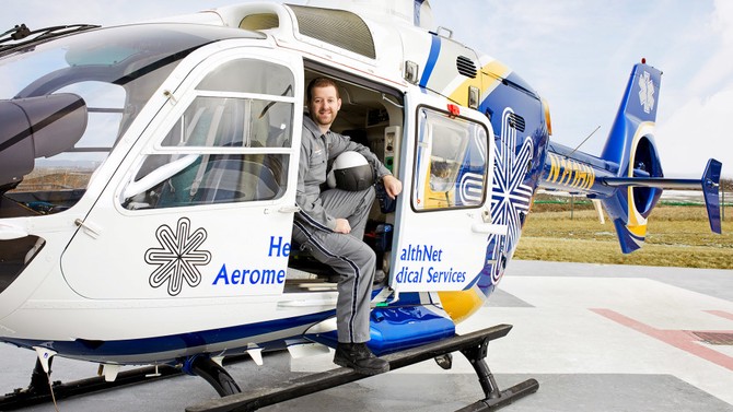 a photo of Kevin Steurer sitting in  his helicopter