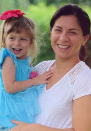 Regina holding her daughter