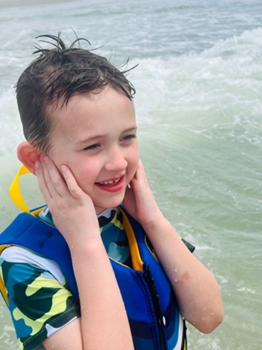 Ranzi's first child on a day at the beach