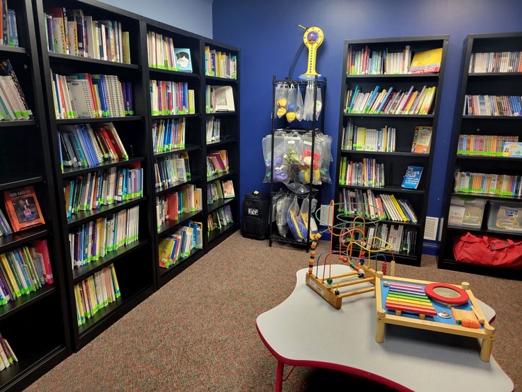 Disability Resource Library space with bookshelves and educational materials for community use